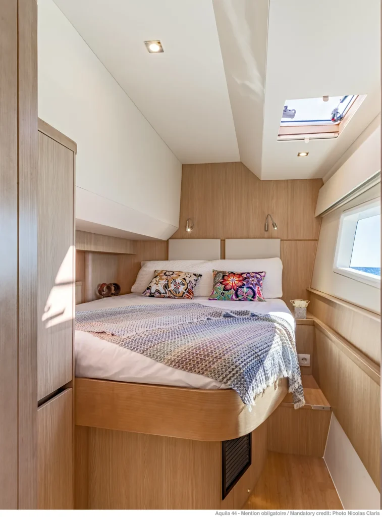 Double berth with natural timber joinery